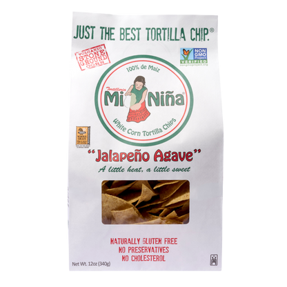 A 12 oz bag of Mi Niña Tortilla “Jalapeño Agave” Chips features “Just the Best Tortilla Chip,” is gluten-free, non-GMO, and shows chips through a clear window. Available as a 9 pack.