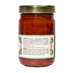A 6-pack of Mi Niña Tortilla Mild Tomato Salsa in clear 12.8 oz glass jars, each topped with a gold lid and featuring green and red pepper graphics beside nutrition facts on the back label.