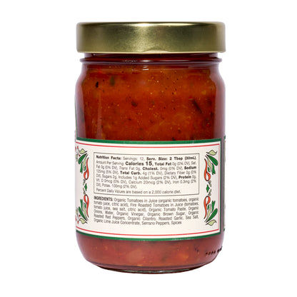 A 6-pack of Mi Niña Tortilla Mild Tomato Salsa in clear 12.8 oz glass jars, each topped with a gold lid and featuring green and red pepper graphics beside nutrition facts on the back label.