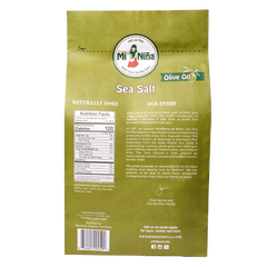 Back of a Mi Niña Tortilla Sea Salt Made with Olive Oil Tortilla Chip (9 Pack / 10 oz) bag, showing brand logo, nutrition facts, ingredients, company story, and social media info on a beige background.