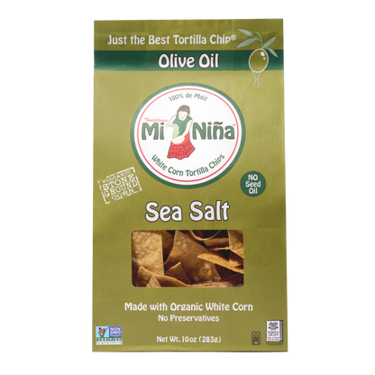 A green box of Mi Niña Tortilla Sea Salt Made with Olive Oil Tortilla Chips (9 Pack / 10 oz) displays chips through a clear window and features 100% de maíz, No Seed Oil, and Made with Organic White Corn.