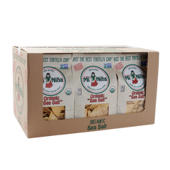 A cardboard box labeled Mi Niña Tortilla Organic Sea Salt White Corn Tortilla Chip - 9 Pack / 12 oz, with three chip bags partially visible through a front cutout.