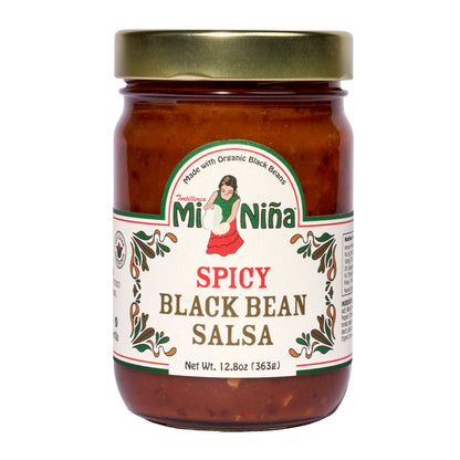 A 6 pack of Mi Niña Tortilla Spicy Black Bean Salsa, 12.8 oz jars with gold lids, each featuring a woman in traditional dress, green and red text, and decorative designs.