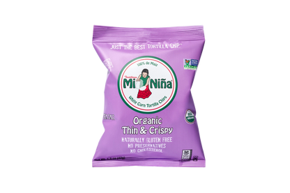 A purple bag of Mi Niña Tortilla Organic Thin & Crispy Sea Salt Chips (24 Pack / 1.5 oz), featuring gluten-free, preservative-free, cholesterol-free, and Non-GMO Project Verified on the packaging.